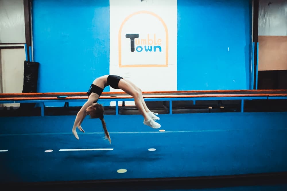 girl doing a back handspring 