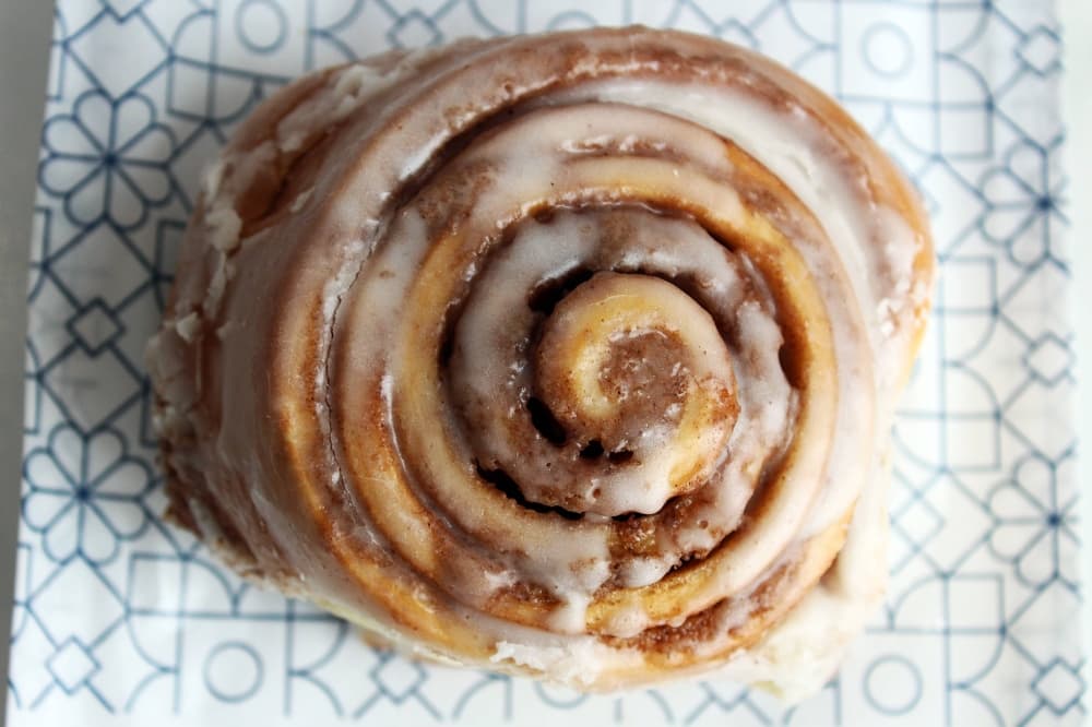 Overhead view of glazed cinnamon roll. 