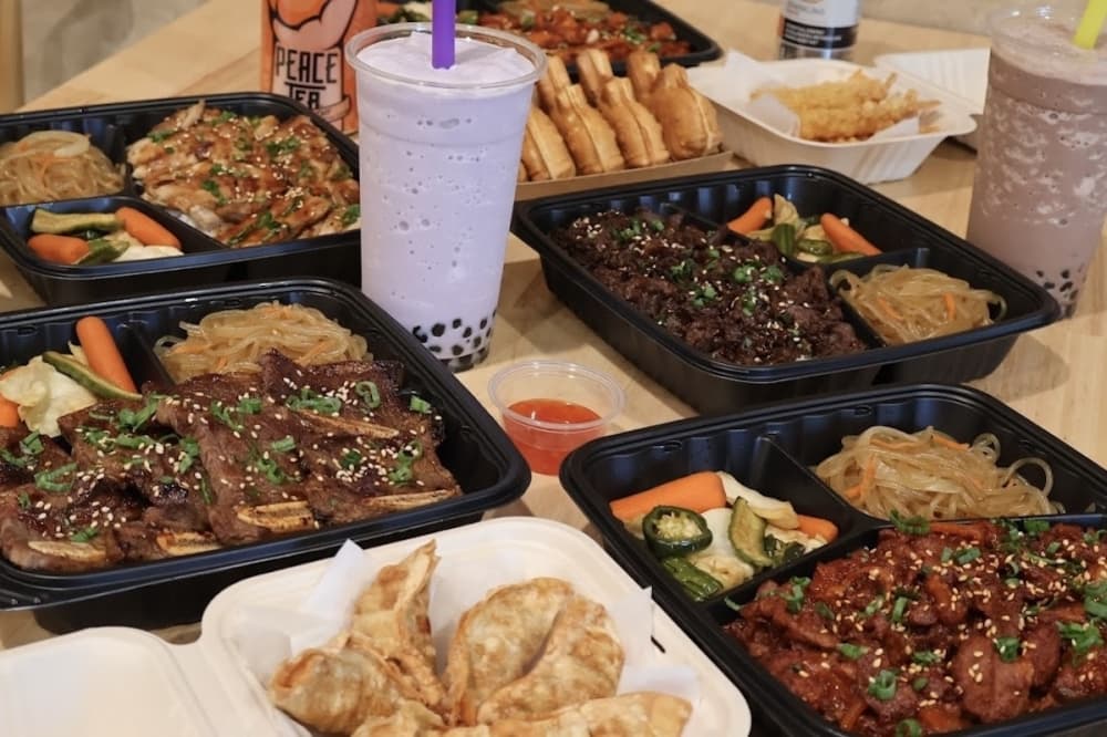 Variety of plates with sections with different food items in each section of each divided plate. 
