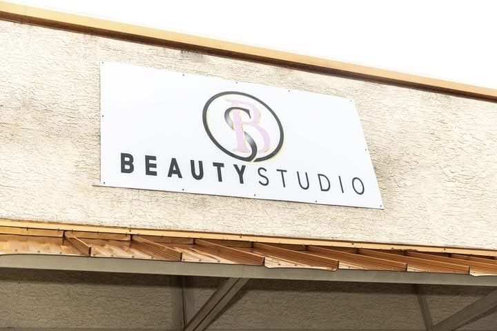 A building with a sign that says beauty studio.