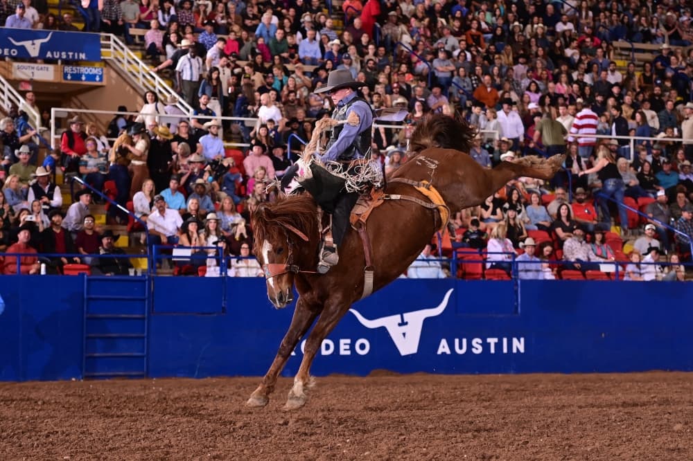 An image of a man on a horse for a rodeo event. 