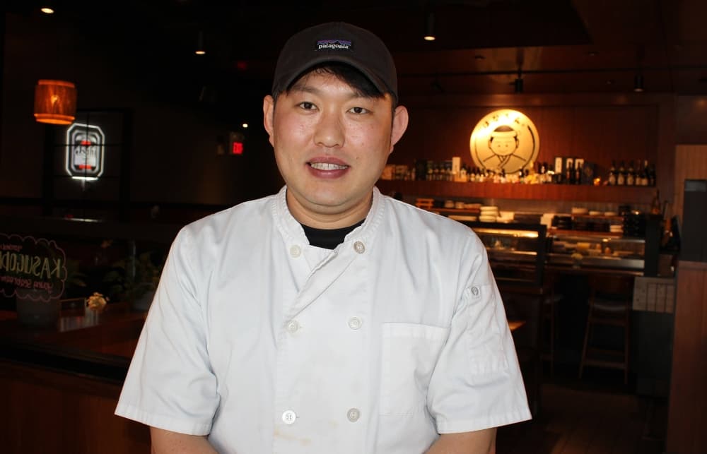 Male wearing chef jacket. 