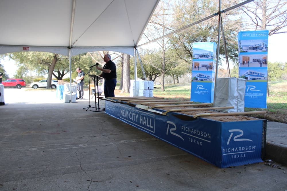 A man speaks at a podium