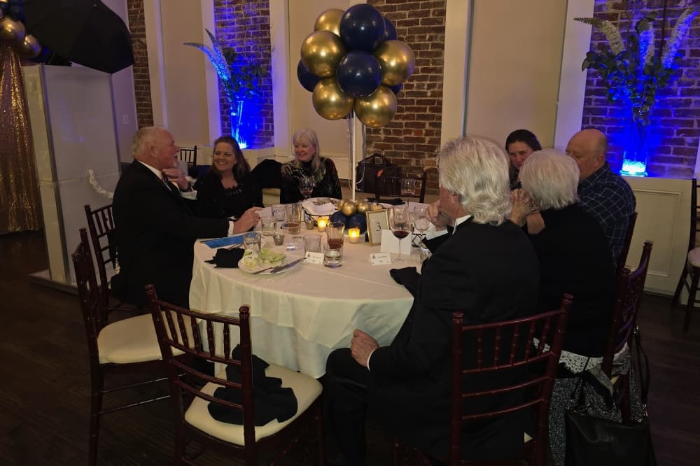 Group of people at a table at a party