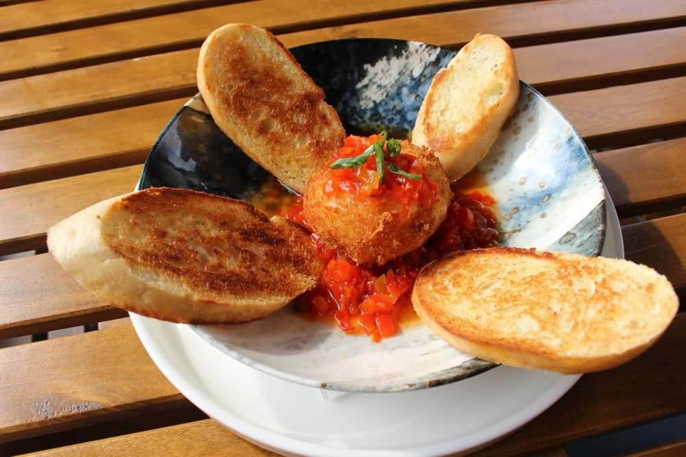 The tempura-battered burrata cheese appetizer ($18) is an example of the innovative menu expansions Montiel has implemented since opening the brick-and-mortar Fusion Grill in April 2017. (Asia Armour/Community Impact)