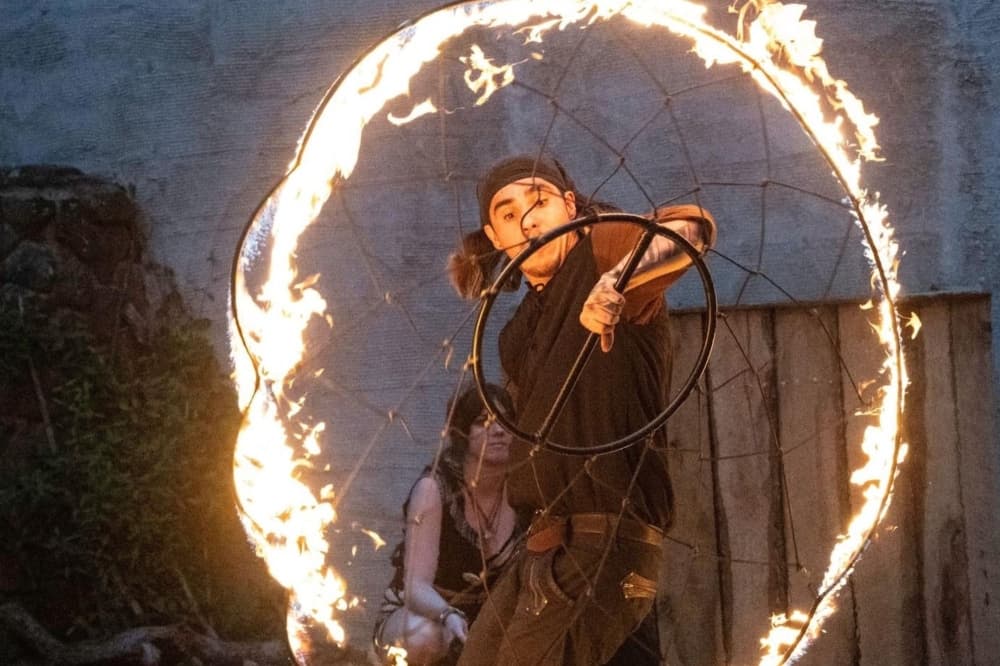A fire thrower is shown from Sherwood Forest Faire