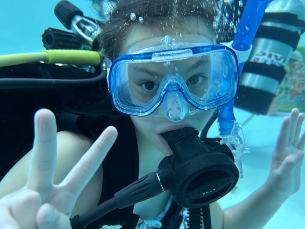 kid in scuba diving gear 