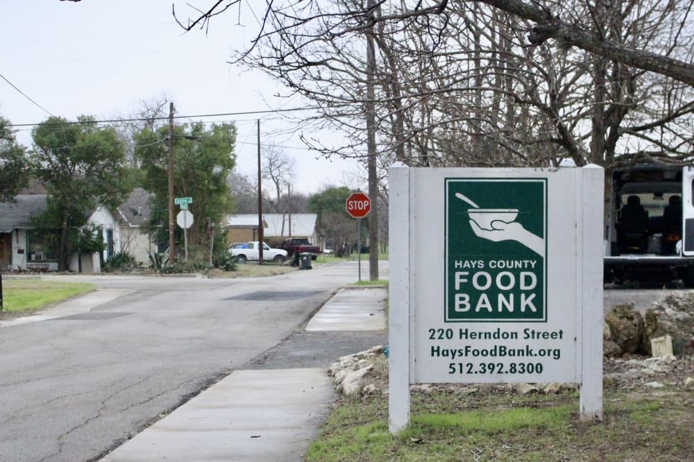 A photo of a sign that says Hays County Food Bank.