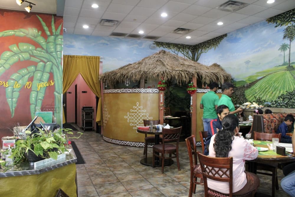 An image of the restaurant decor and hut. 