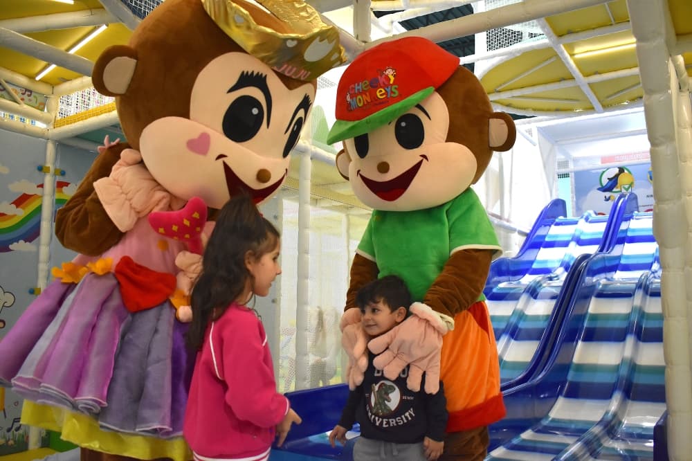 monkey mascots with children