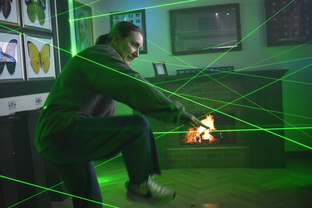 A woman completes a laser challenge.