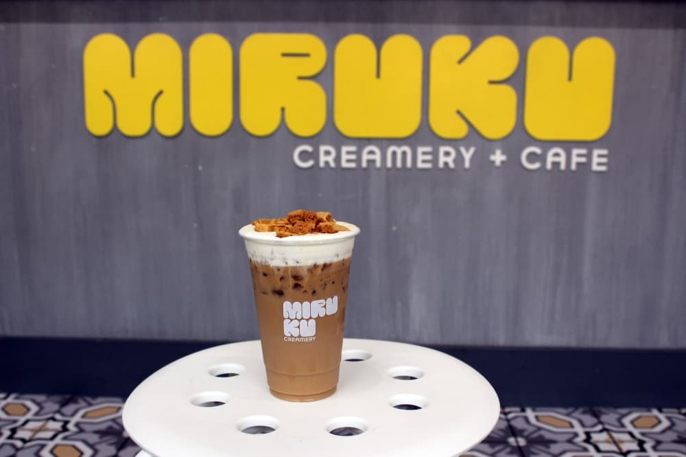 Coffee with cream and candy topping. 