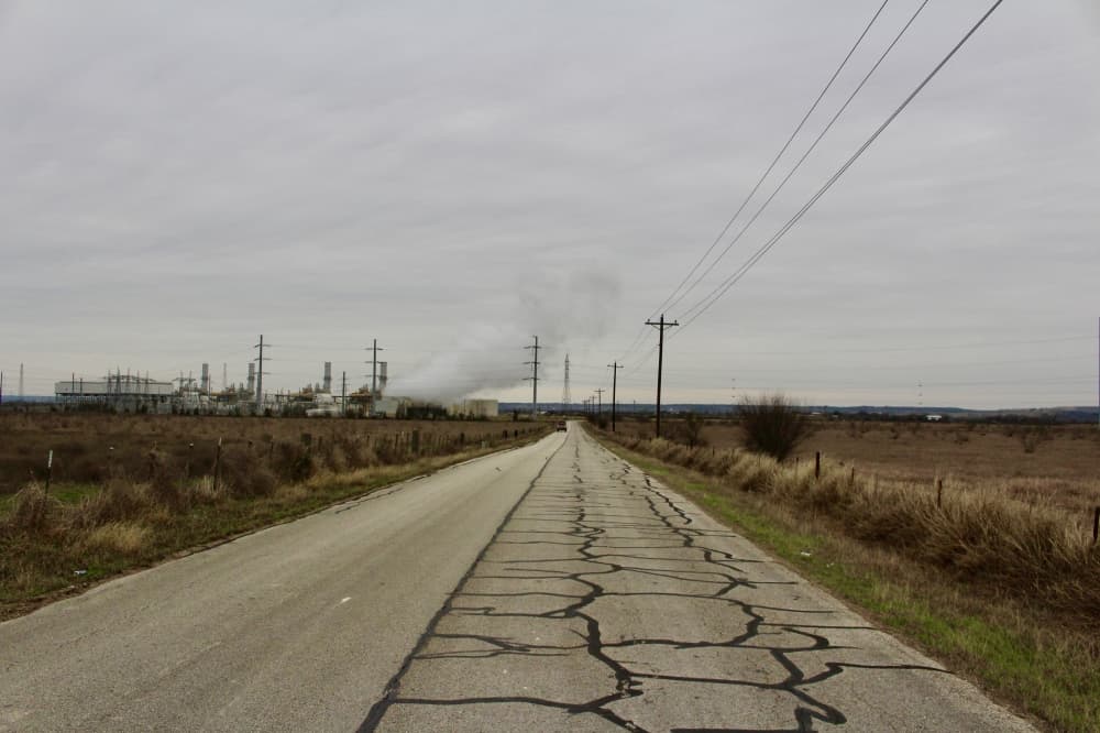 A photo of land split by a road. 