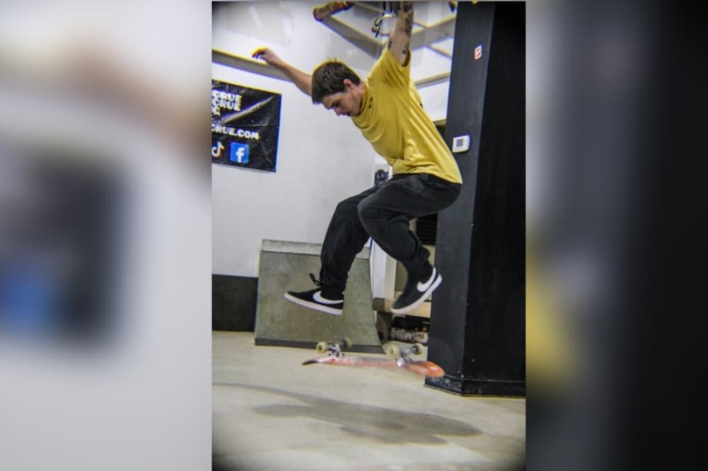 A young skateboarder performing an ollie. 