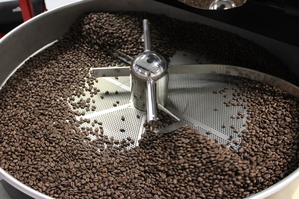 Coffee beans get roasted. 
