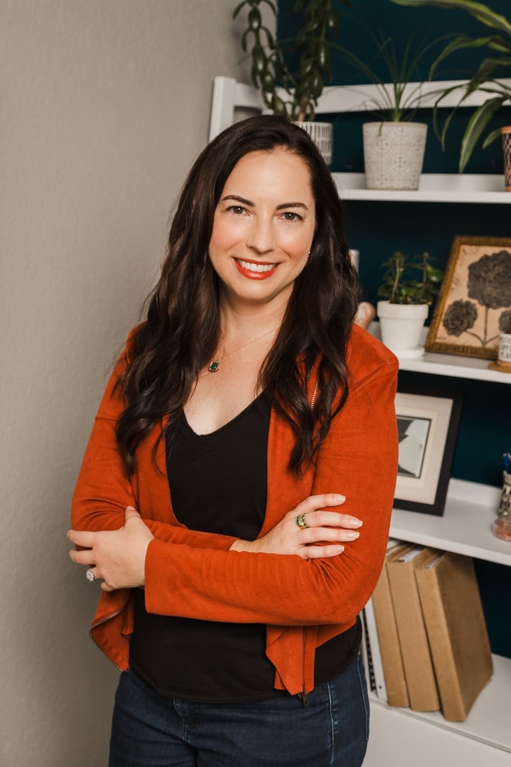 woman in red-orange cardigan 