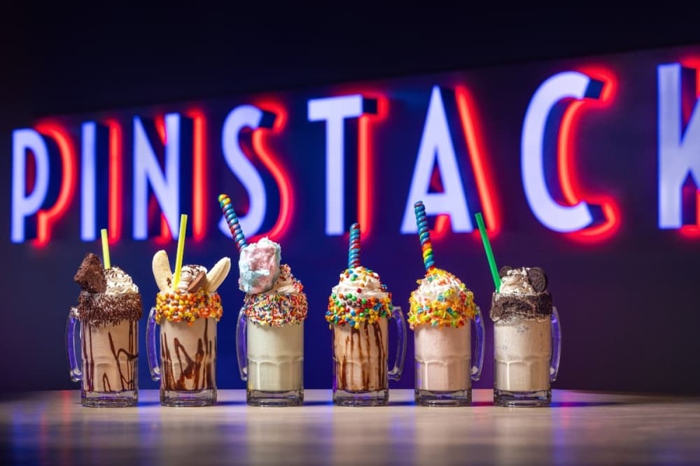 Pinstack offers stacked milkshakes that include cookies, candy, cotton candy, red velvet cake, chocolate or bananas. (Courtesy Pinstack)