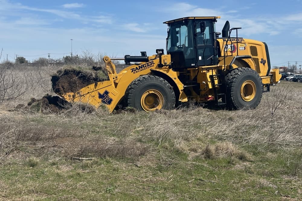 In addition to the ceremonial moving of dirt, attendees were able to see the first dig into the property using a wheel loader. Randall Tuller, senior vice president at Mark IV Capital, said construction work would officially begin later in the day. (Brooke Sjoberg/Community Impact)