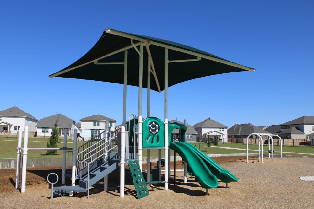 The neighborhood offers a playground as well as walking trails. (Anna Maness/Community Impact)