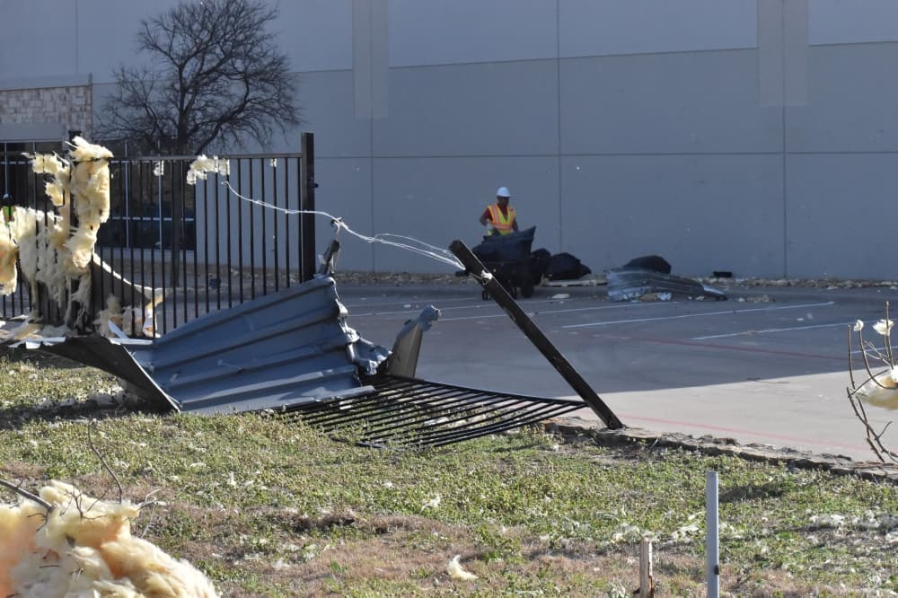 Debris from a Benjamin Moore distribution facility scattered nearby and damaged a fence surrounding the property.