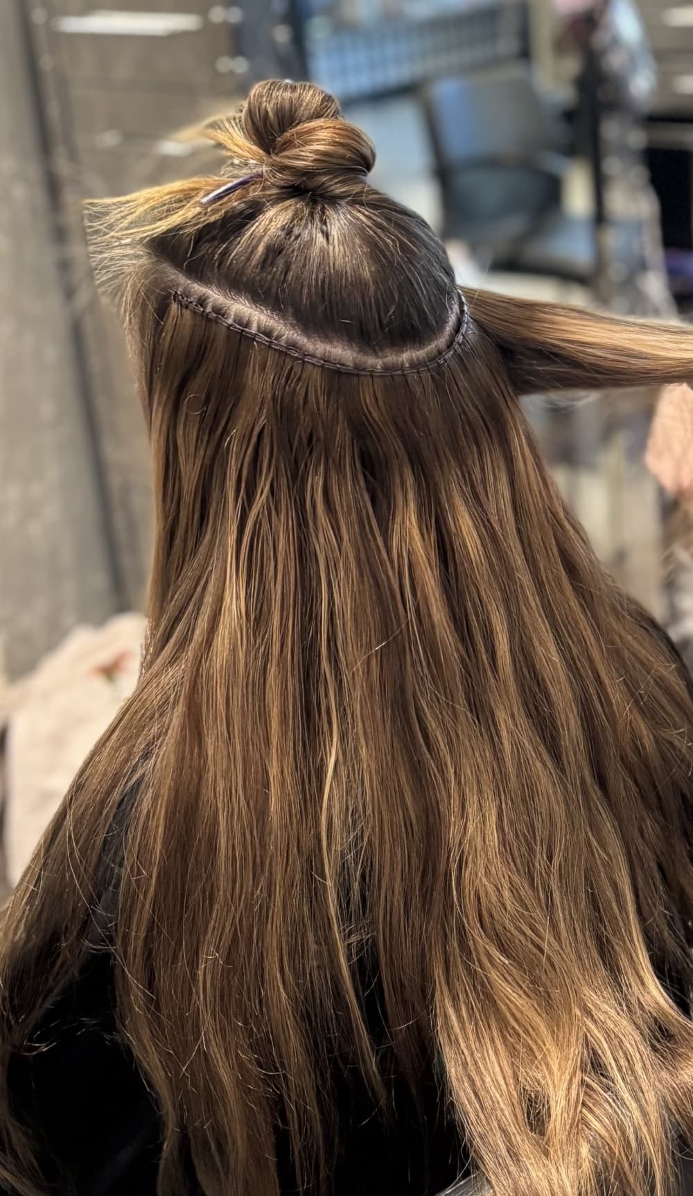 girl getting hair extensions