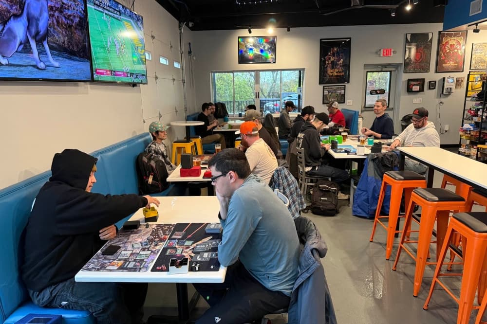 An image of people playing games at the business. 