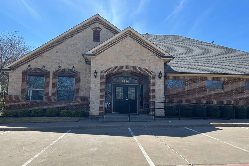 Exterior of a two-colored brick building. 
