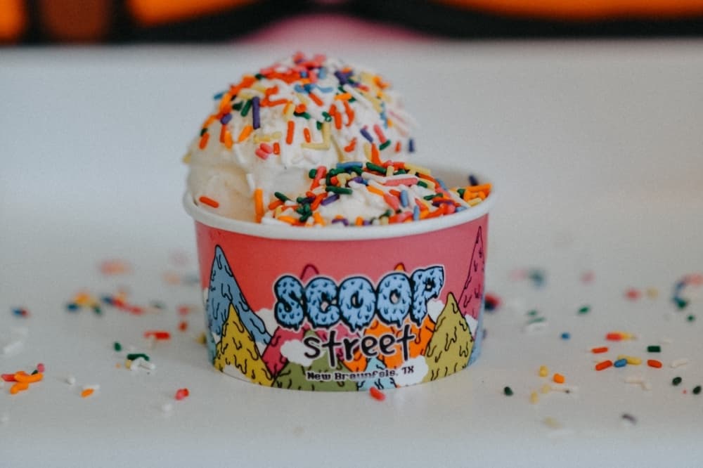 One scoop of vanilla ice cream ($4.75) with rainbow sprinkles. (Courtesy Scoop Street)