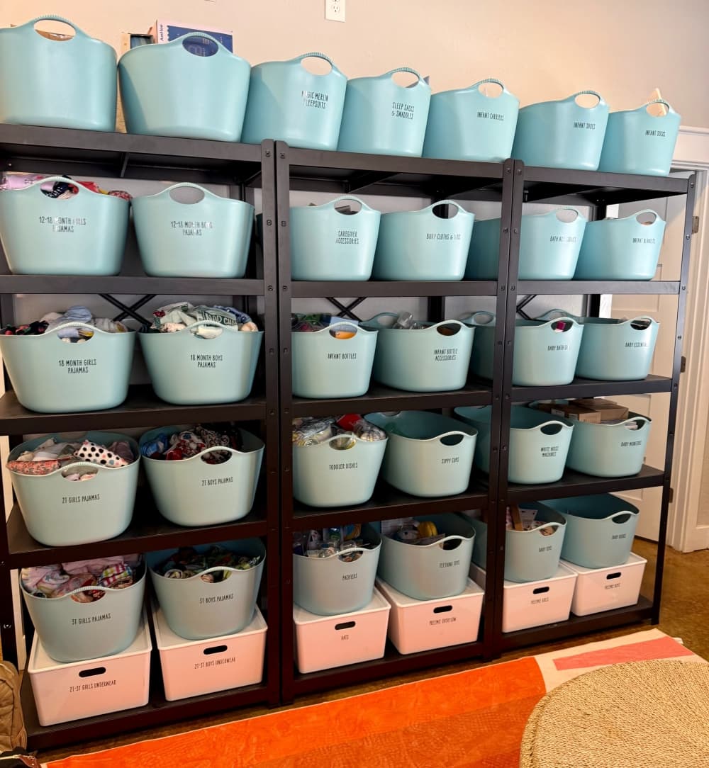 Containers of baby and toddler items on a shelf