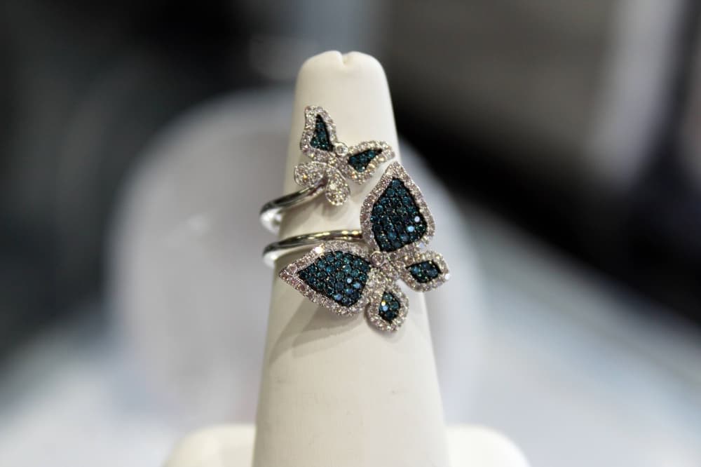 Blue gems in a double butterfly ring. 