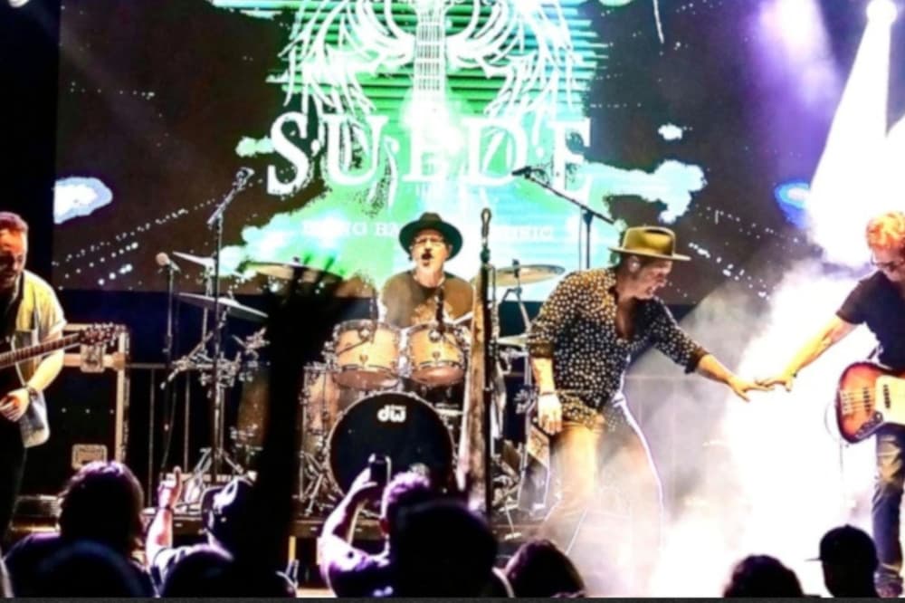 An image of the band performing at another venue. 
