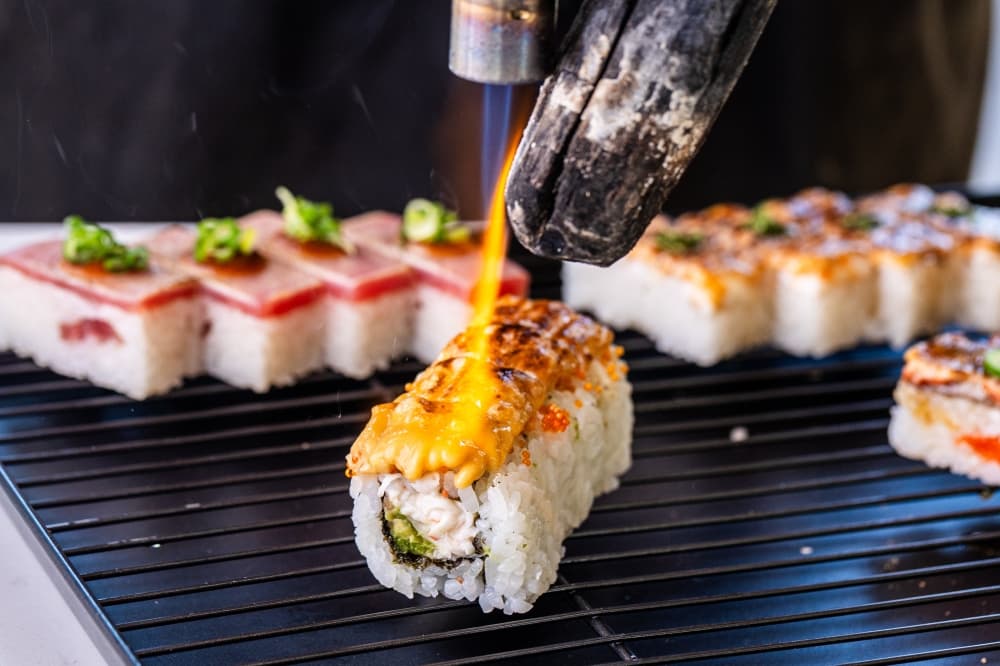 Aburi Oshi Sushi serving flame-seared sushi at the downtown Fareground Austin