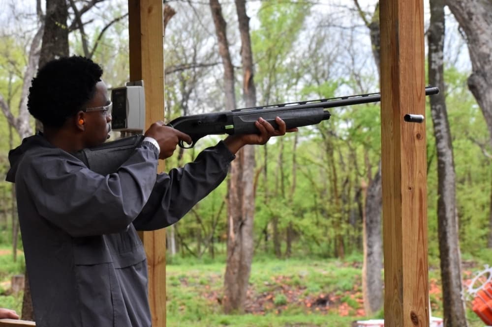 man shooting a gun 