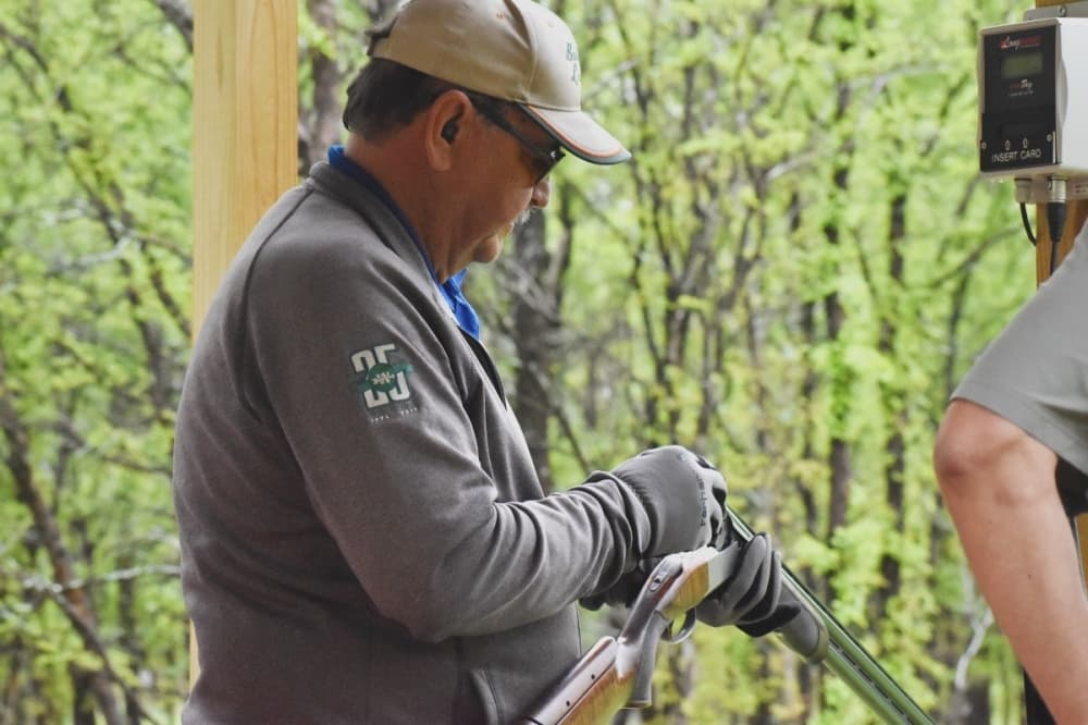 man reloading gun 