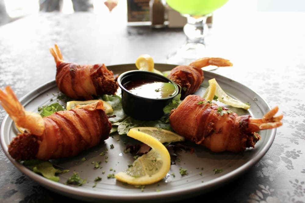 The shrimp diablos ($16.99)—bacon-wrapped shrimp with fresh jalapeños and stuffed with cream cheese. (Jovanna Aguilar/Community Impact)