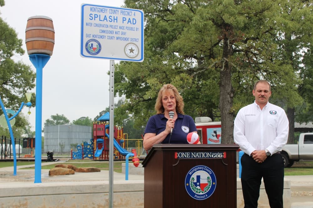 EMCID Board Chair Brenda Webb and Precinct 4 Commissioner Matt Gray spoke at the reopening of the Bull Sallas Park splash pad on April 1. (Jessica Shorten/Community Impact)