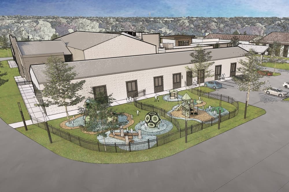 Rendering of a church with playgounds next to the building. 