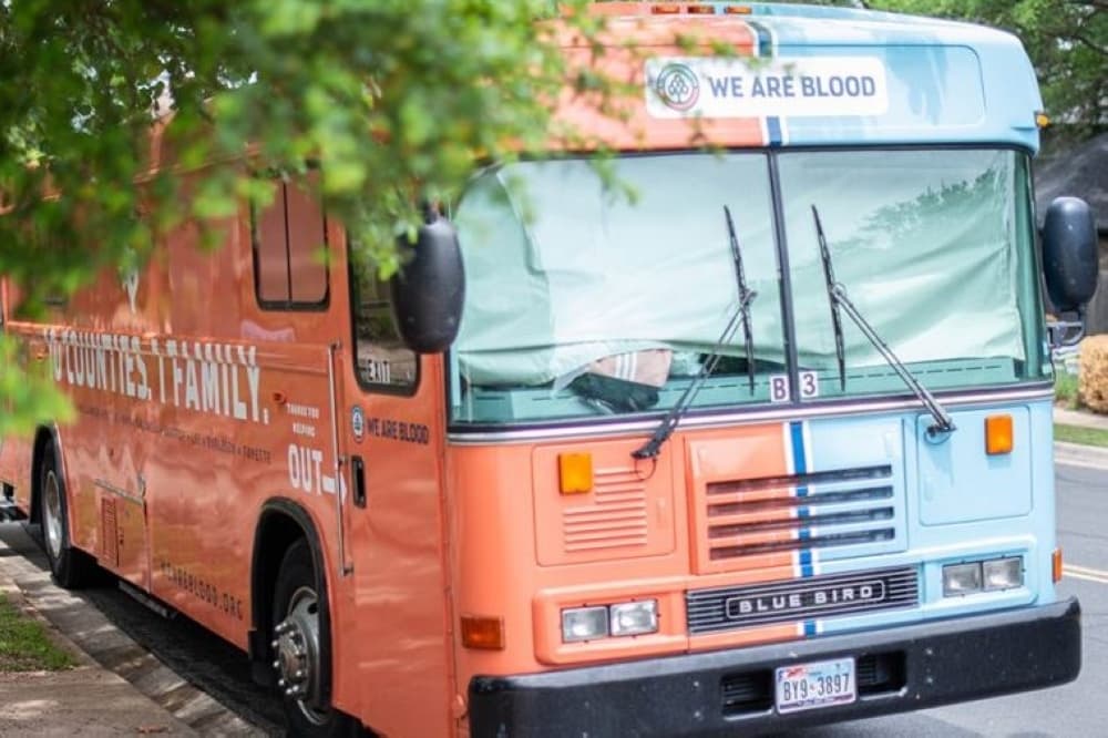 A mobile blood drive bus is shown.