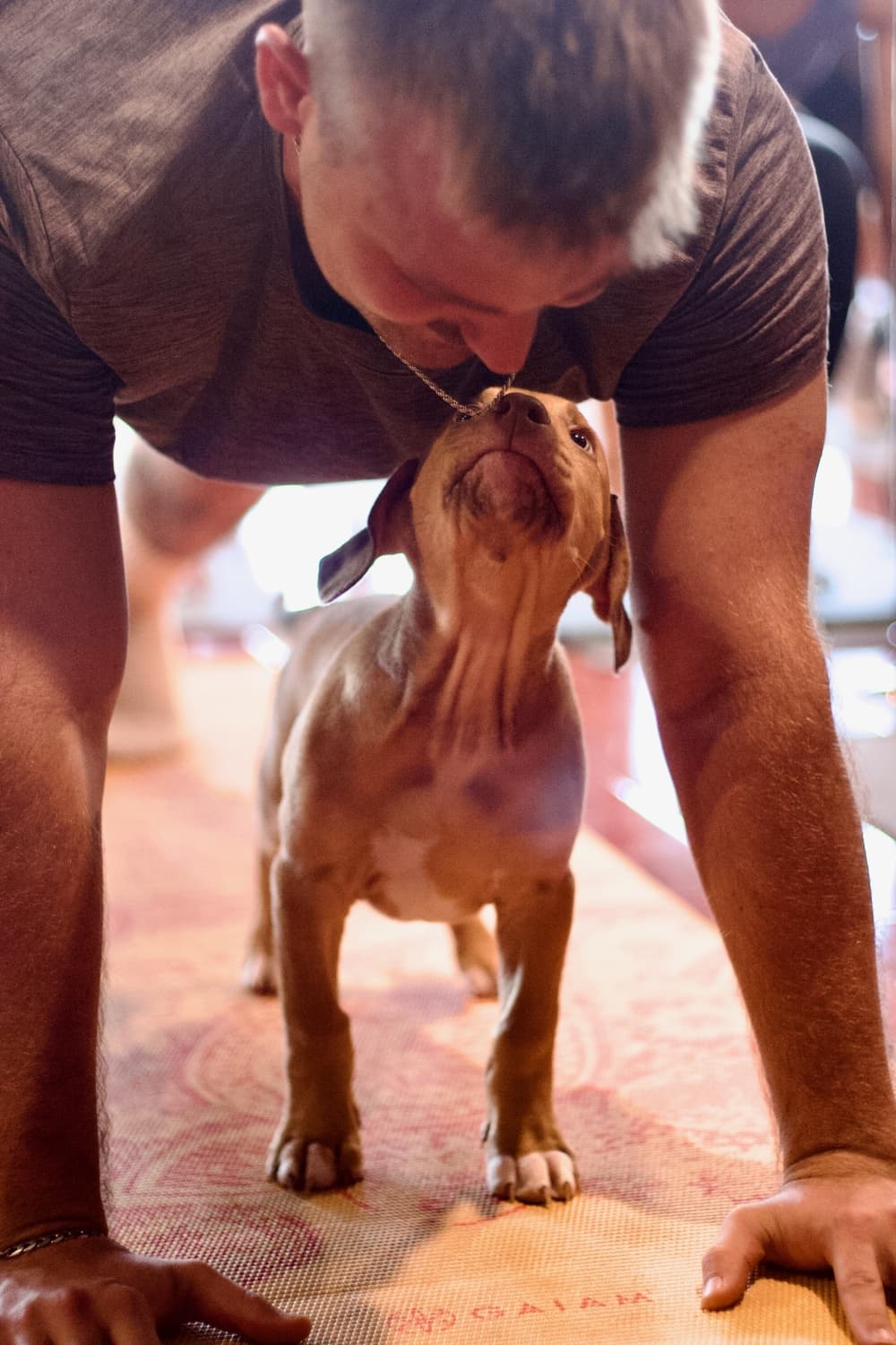 An image of a previous attendee with a puppy. 