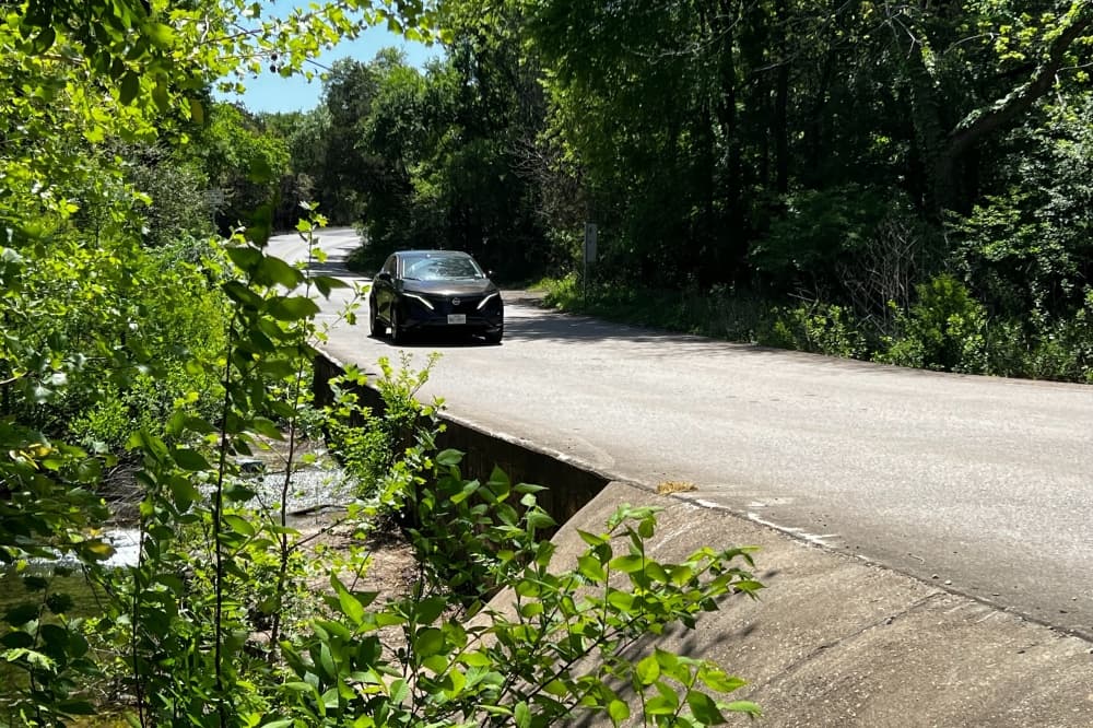cars driving over bridge 