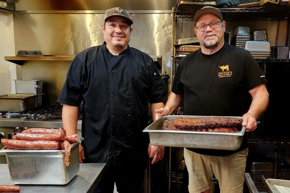 Fritze's pitmaster Victor Garza (left) and owner Robert Reed (right) have worked together to maintain the legacy of the restaurant. (Jarrett Whitener/Community Impact)