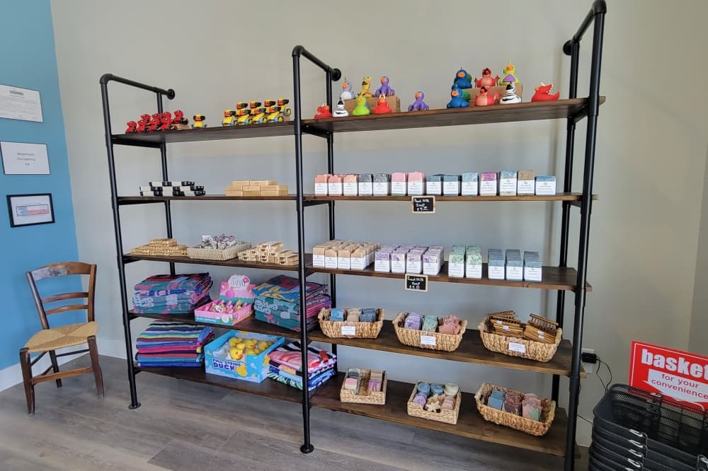 Shelf of soaps and bath bombs