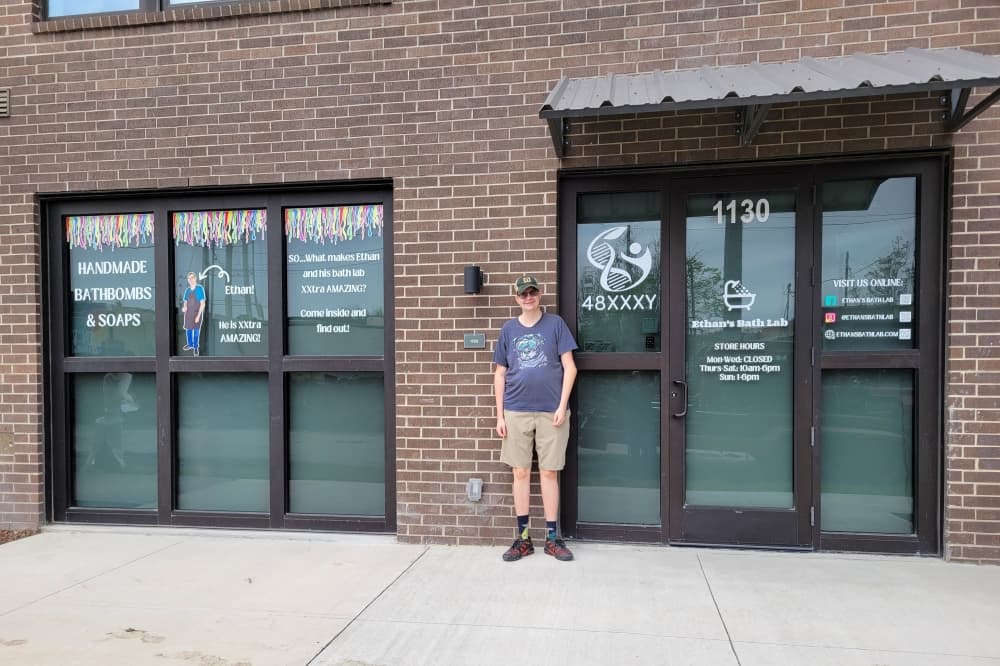 Ethan Leiker in front of Ethan's Bath Lab