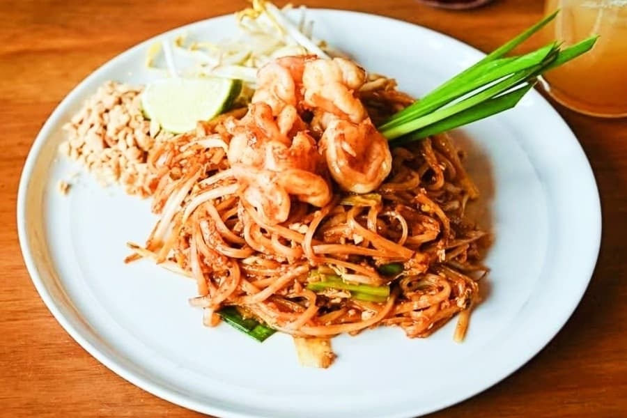 Plate of noodles in red sauce. 