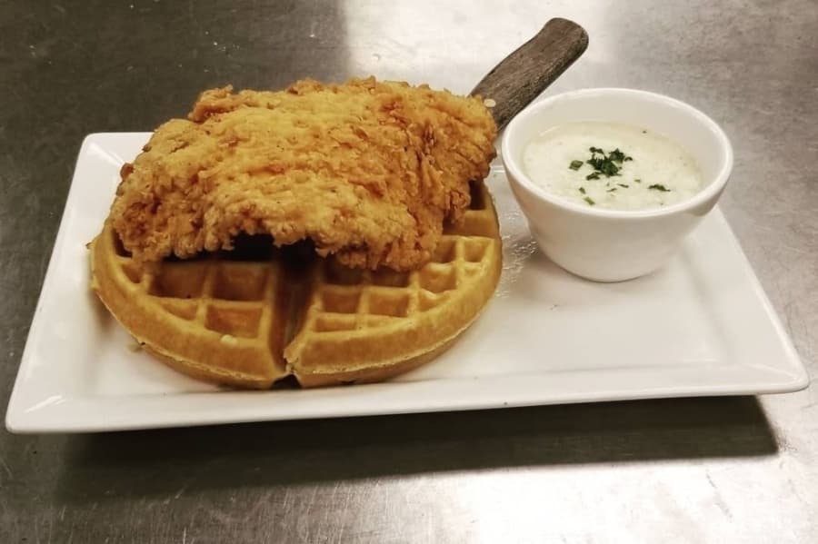 Waffle topped with fried chicken. 