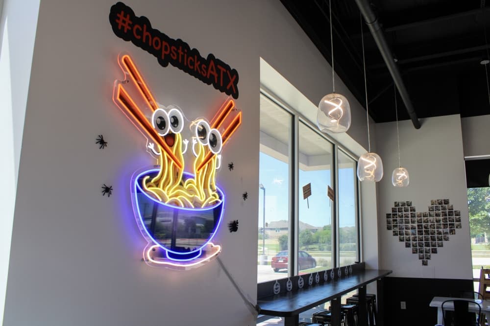 An image of the sign of the business inside. 