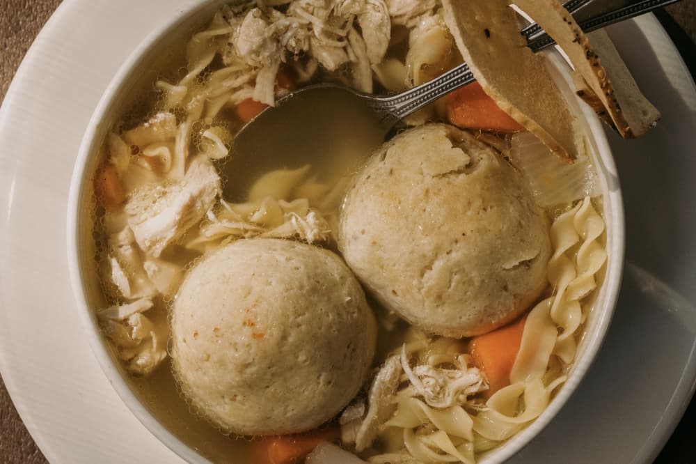A Jewish Delicatessen speciality, the Chicken Matzoh Ball Soup ($8.95)  consists of homemade chicken soup, matzoh balls, pulled chicken, vegetables and noodles.  (Courtesy Max and Louie's New York Diner)