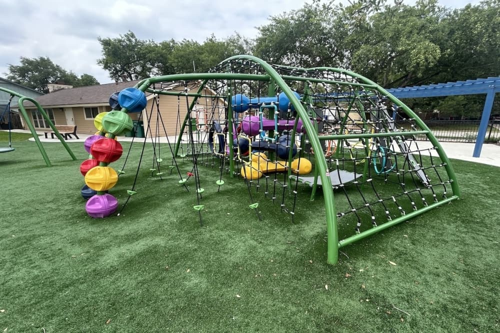 A children's play area at a park in Universal City, Texas is shown.