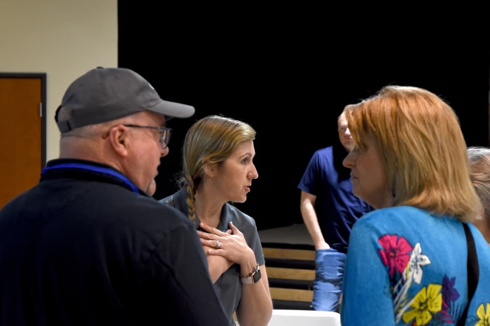 Mayor speaks with members of the community. 