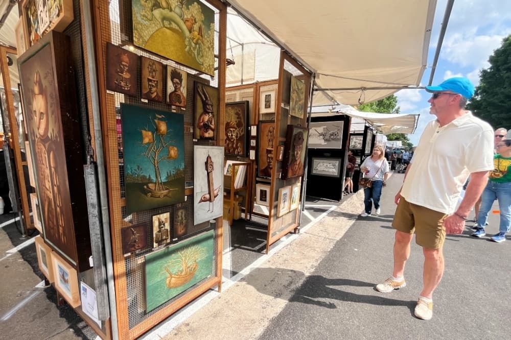 person looking at art work